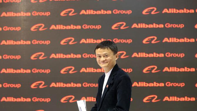 Jack Ma, founder and CEO of the Alibaba Group walks through the Chinese pavilion on the opening day of the Cebit 2015 tech fair in Hannover, northern Germany, Monday, March 16, 2015. China is this year's official partner country. (AP Photo/dpa, Christian Charisius)
