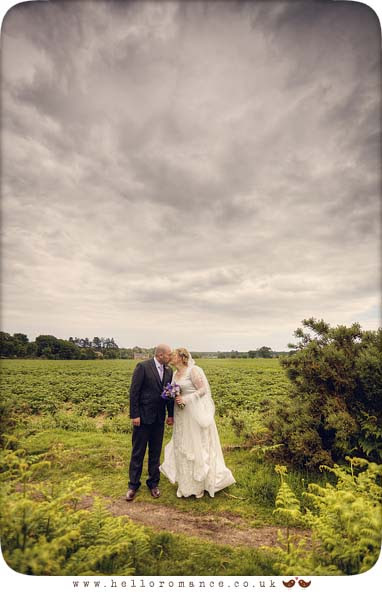 Kissing at wedding in field Cute - Suffolk Bromswell Eyke Vintage English wedding Photography - Hello Romance