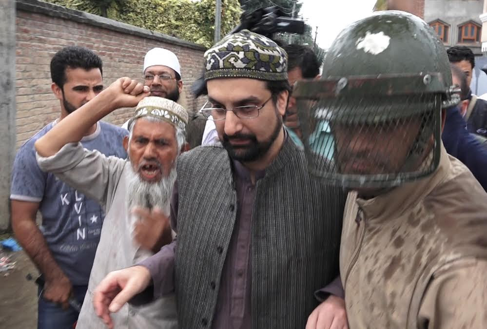 Mirwaiz Umar Farooq being arrested on way to Eidgah on August 26, 2016.