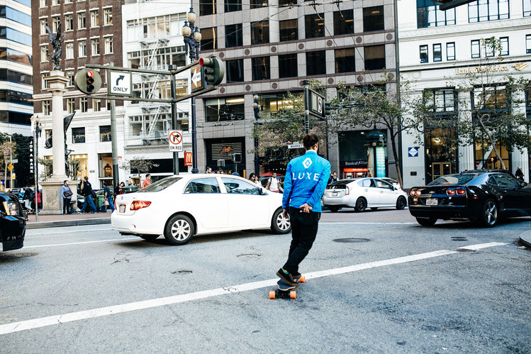 Luxe provides valets who meet drivers at their cars and park them. This employee navigates the streets on his skateboard.