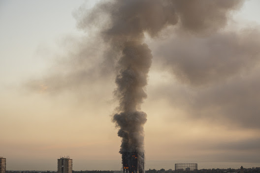 Grenfell Tower, North Kensington, pluming smoke. Image © Selim Halulu