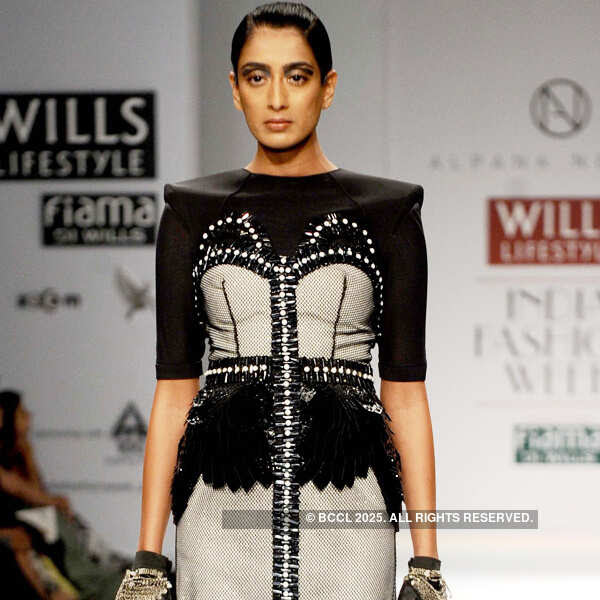 Model Binal Trivedi showcases a creation by designers  Alpana and Neeraj on Day 2 of the Wills Lifestyle India Fashion Week (WIFW) 2013, held in Delhi. 