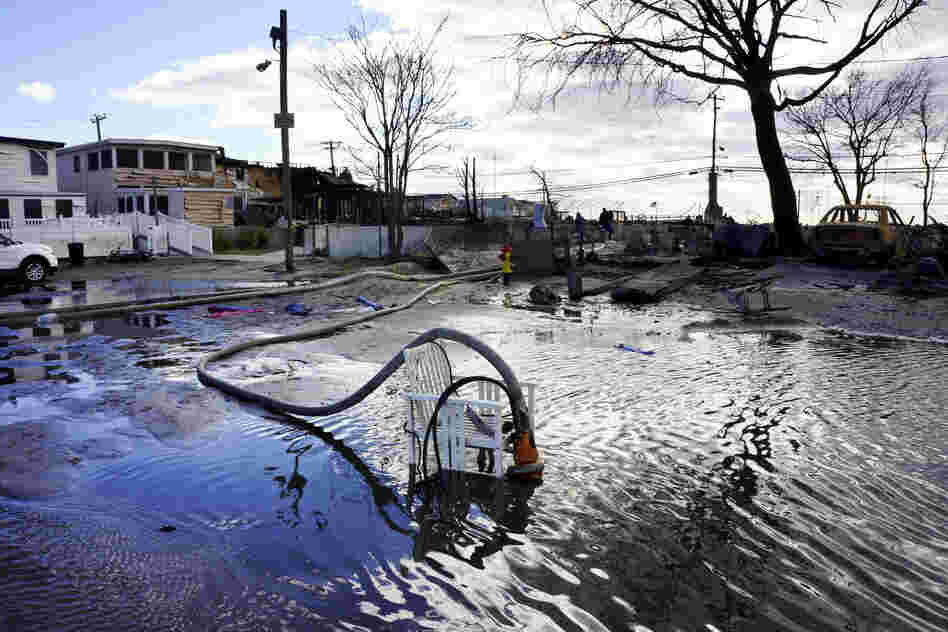Fire Fighters are now part of a massive de-watering effort in Breezy Point. "We're trying to put the water back where it came from," says Chief Pfifer.