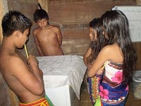 Some of Kyra’s young students practice their knowledge of numbers in English by playing a memory game.