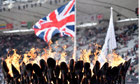 The Union flag flutters above the Olympic flame
