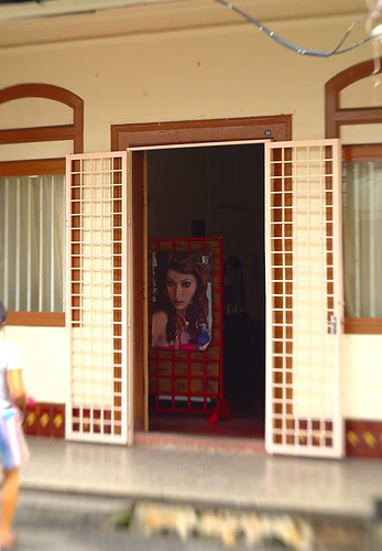 face glimpsed through a door