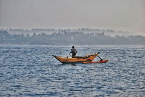 A fisherman heads back with his catch