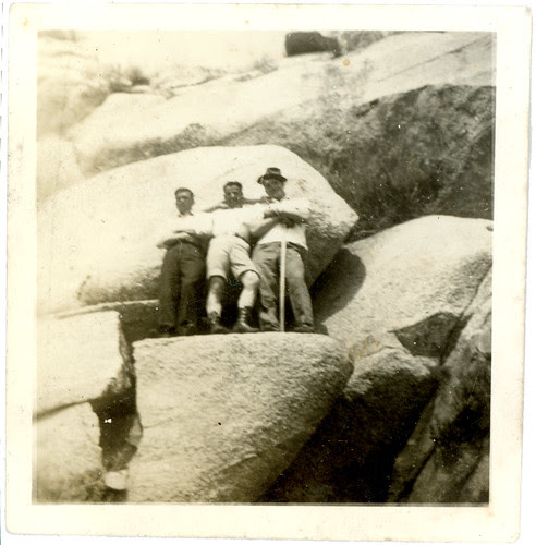 three guys on a cliff