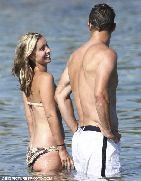 Jamie Redknapp and Louise Redknapp cool down in the sea while on holiday in Italy