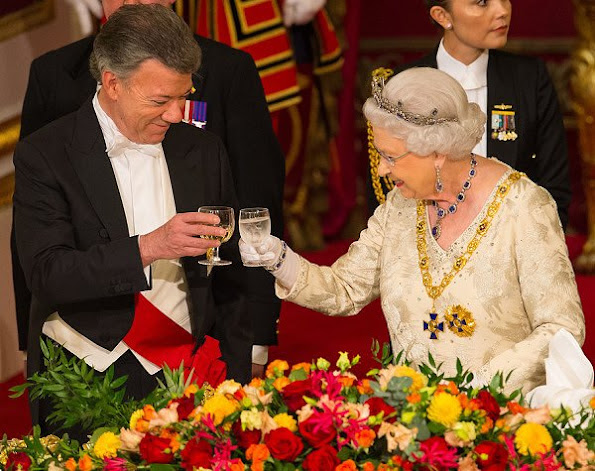 Queen Elizabeth diamond tiara, wore satin long, Maria Clemencia Rodriguez wore dress, diamond earrings