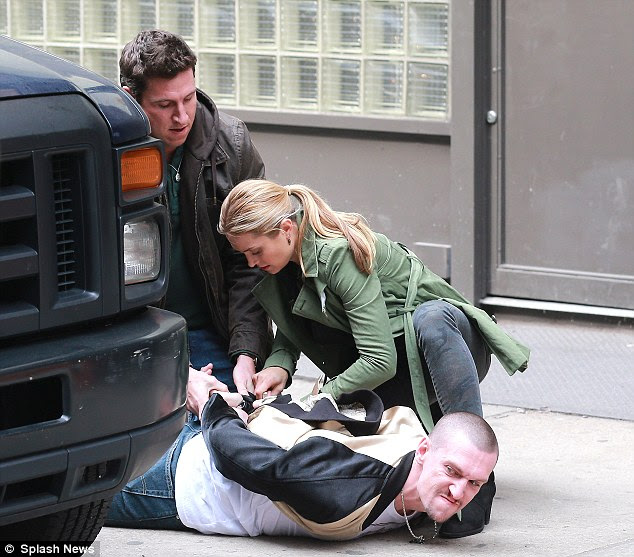 Cuff him! Spencer got to wrestle the suspect to the ground and put the cuffs on him while co-star Pablo Schreiber helped