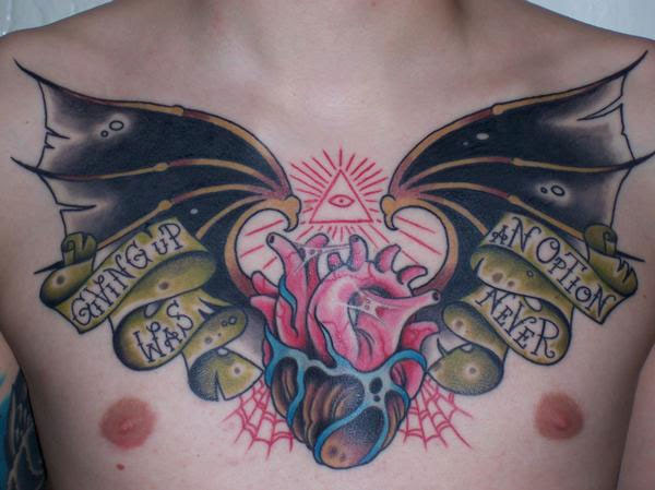tattoo chest piece. Here's a great chest tattoo of bat wings on a heart.