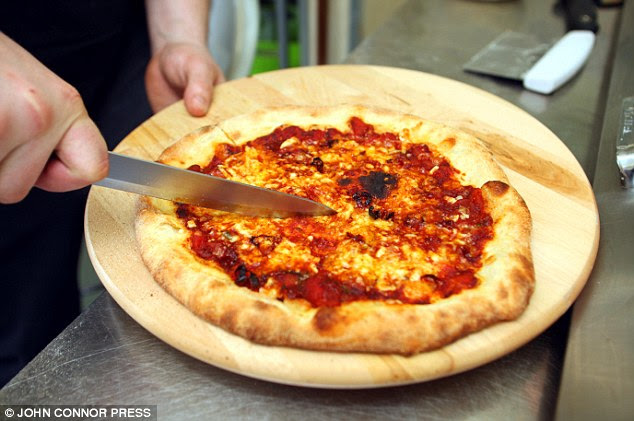 Hot: The pizza measures a whopping 3.2 million on the Scovell scale - which measures the pungency of chilli peppers