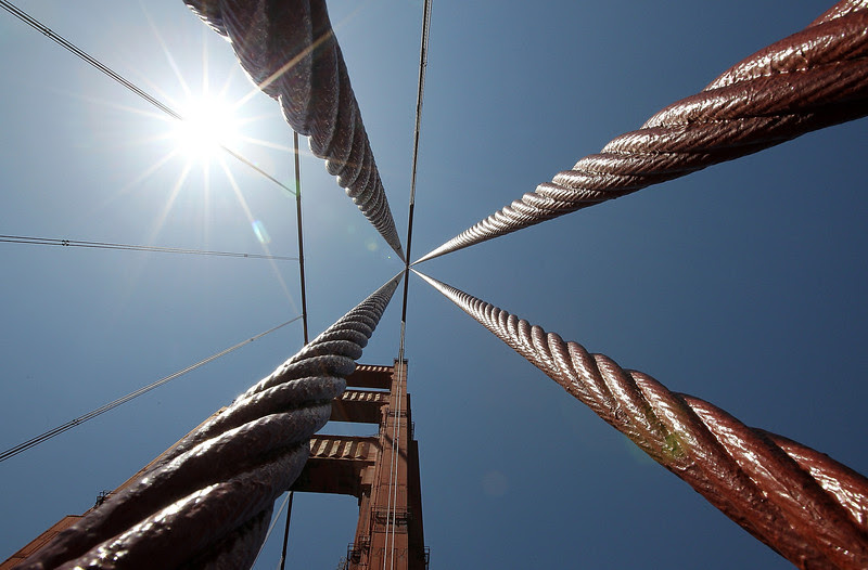 Description of  A view of suspender ropes and the south tower of the Golden Gate Bridge on May 24, 2012 in San Francisco, California. The Golden Gate Bridge, Highway and Transportation District was preparing for the 75th anniversary of the iconic Golden Gate Bridge. The 1.7 mile steel suspension bridge, one of the modern Wonders of the World, opened to traffic on May 28, 1937. (Photo by Justin Sullivan/Getty Images)