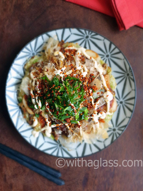 Okonomiyaki Japanese Savoury Pancake With Eringi Mushrooms With A Glass