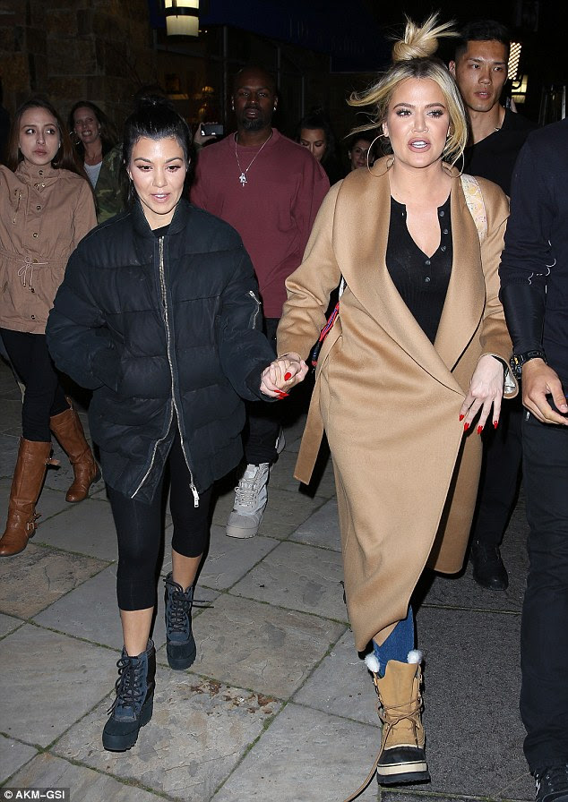Ouch: the 31-year-old reality star - pictured with older sister Kourtney, 36, in Vail, Colorado on Wednesday night - is said to feel 'betrayed' as a source said: 'This feeling has never changed. After finding out about the engagement, she is furious at the lack of respect'