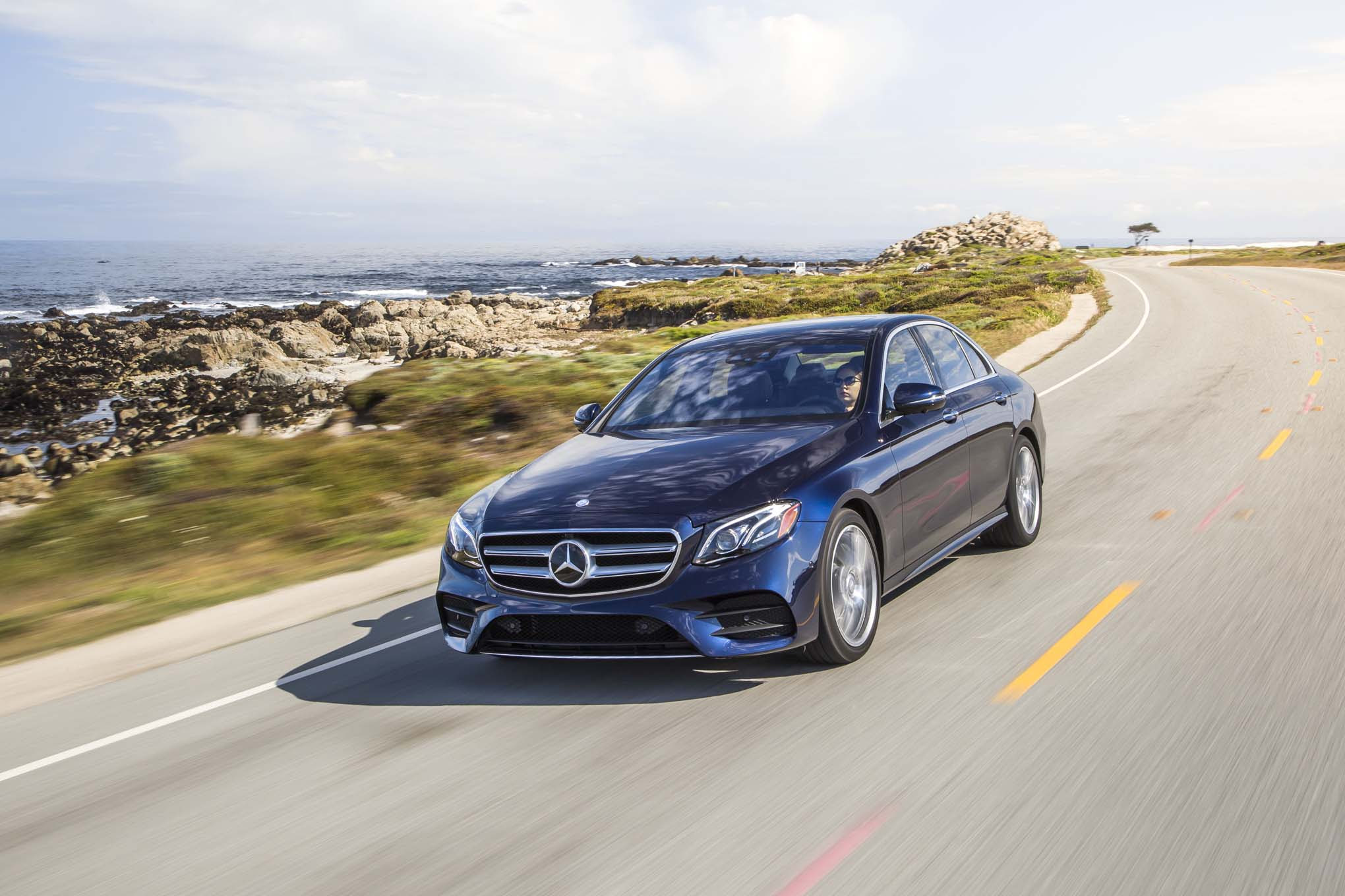 2017 Mercedes Benz E300 4Matic front three quarter in motion 06
