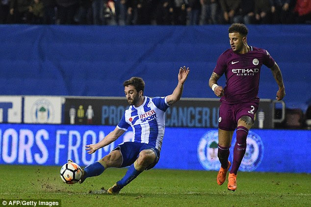 Will Grigg (left) scored the winning goal with one of Wigan's two shots on target 
