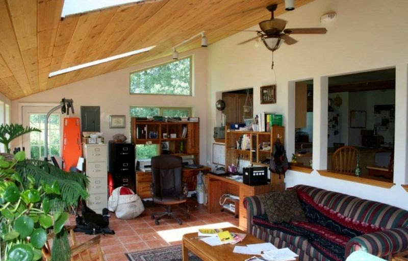 Sunroom which is heated and used as an office and family room.