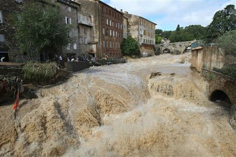 The river Artuby floods Draguignan, southern France, Wednesday, June 16, 2010. Regional authorities in southeastern France say at least a dozen people have been killed and many are missing in the aftermath of flash floods that followed powerful rainstorms.Unusually heavy rains recently in the Var region have transformed streets into muddy rivers that swept up trees, cars and other objects.