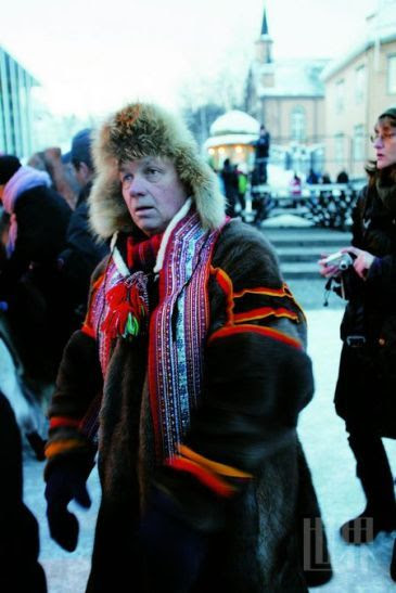 Dressed in national costumes of Sami