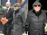Gary Glitter arrives back home after a day at the police station