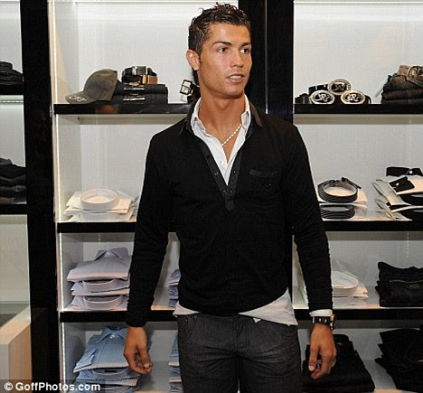 cristiano ronaldo haircut 2009. Cristiano Ronaldo poses at the