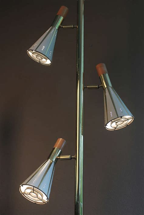 The globes have beautiful ruffled tops with gilded vines & leaves applied to the glass. Mid century floor lamps - when light ought to fall in a