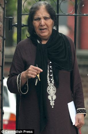 Tallat Ashar is standing in the dock along side her husband
