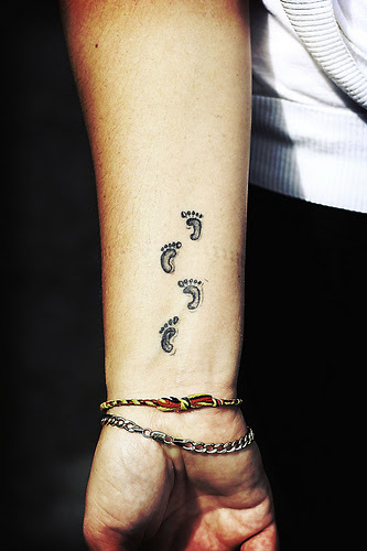 Tattoos For Baby Names. images aby footprints tattoos