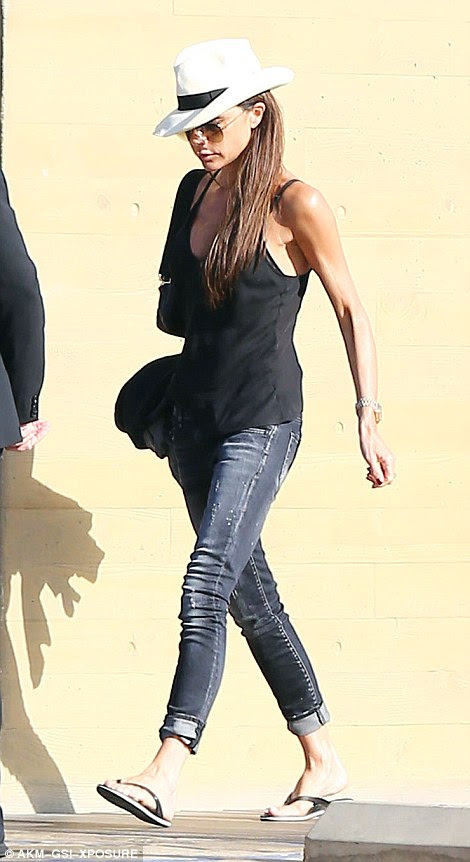 Easy style: Leading the way, 41-year-old Victoria cut a nonchalantly cool figure in a pair of figure-flattering skin-tight skinny jeans in a lightly worn slate grey shade