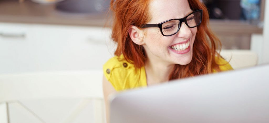 Happy freelancer at her computer
