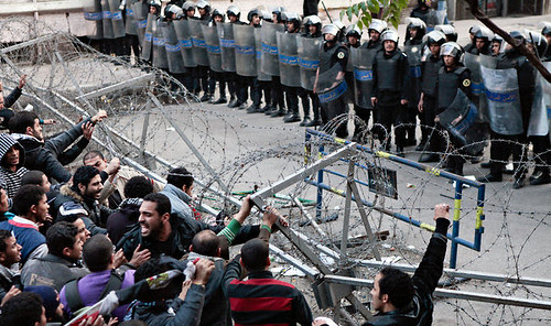 Egyptian confront police in the aftermath of clashes during a soccer game that killed 74 people. Protesters have blamed police for the deaths. by Pan-African News Wire File Photos