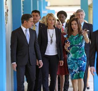 Principal Marta Garcia, right, gives U.S. Secretary of Education Betsy DeVos a tour of Royal Palm Elementary with Miami-Dade Schools Superintendent Alberto Carvalho on Friday.