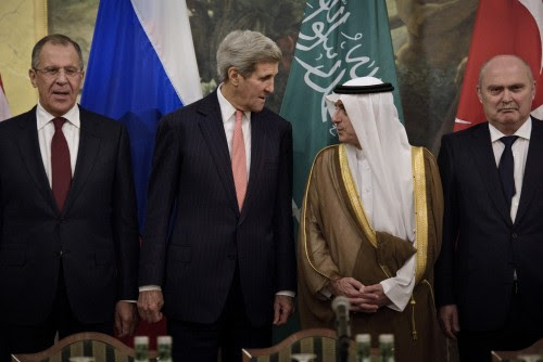 (L to R) Russian Foreign Minister Sergei Lavrov, US Secretary of State John Kerry, Saudi Foreign Minister Adel al-Jubeir and Turkish Foreign Minister Feridun Sinirlioglu stand together before a meeting at the Hotel Imperial at Hotel Imperial in Vienna, October 30, 2015. U.S. Secretary of State Kerry said on Friday he hoped progress could be made at international talks in Vienna aimed at finding a political solution to Syria's four-year-old civil war but it would be very difficult. REUTERS/Brendan Smialowski.