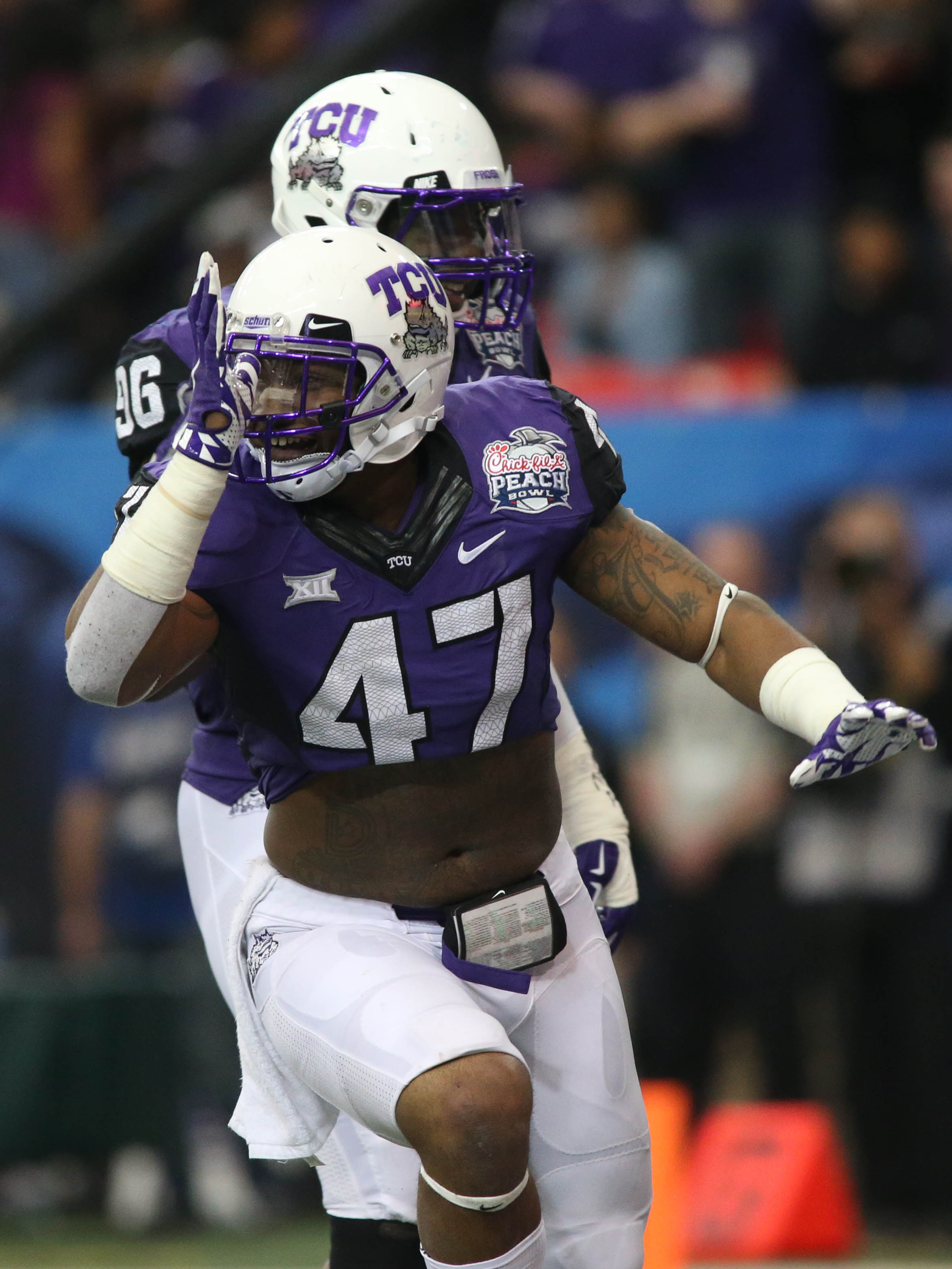 Dec 31, 2014; Atlanta , GA, USA; TCU Horned Frogs linebacker Paul Dawson (47) reacts after sacking Mississippi Rebels quarterback Bo Wallace (not pictured) during the second quarter in the 2014 Peach Bowl at the Georgia Dome. (Jason Getz-USA TODAY Sports)