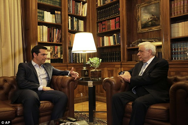 Prime Minister Alexis Tsipras (left), pictured tonight with Greek President Prokopis Pavlopoulos (right), as the Sryiza leader handed in his resignation saying he can no longer command a majority in Parliament 