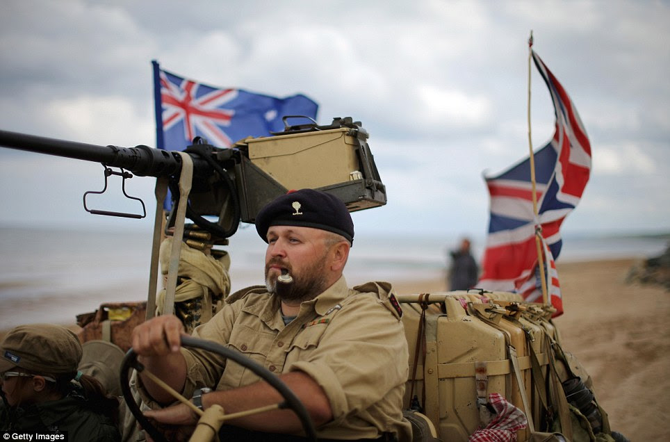 Practice: The events of this weekend in Normandy will be attended by leaders from all over the world. Pictures is a re-enactor preparing for the anniversary on Omaha beach