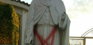 What appears to be a satanic star was painted on a religious statue at St. Emydius Catholic Church. (Screenshot from NBC video)