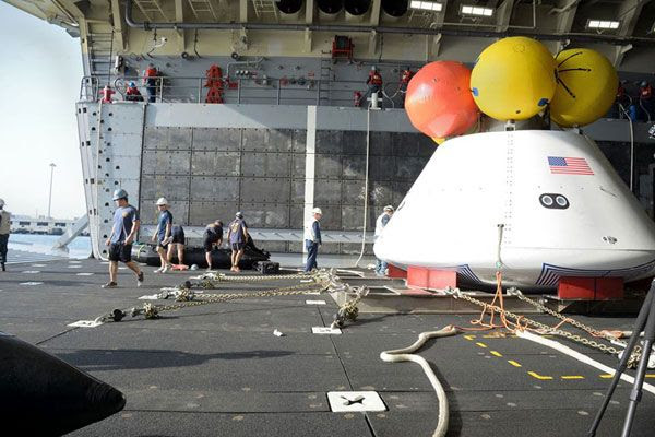 The Orion mockup after it was brought into the well deck of the amphibious transport dock USS Arlington during recovery tests at Naval Station Norfolk, Virginia...on August 13, 2013.