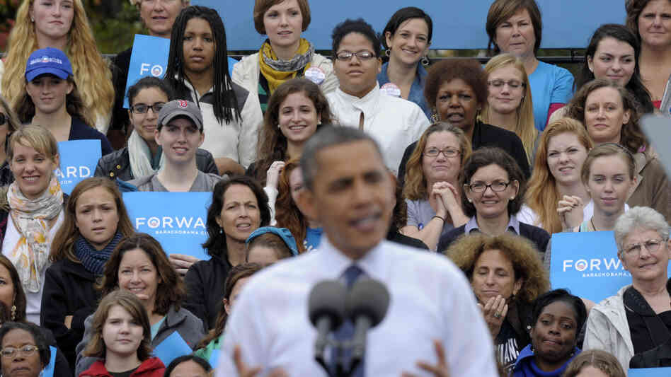 An audience, mostly women, listen behind President Barack Obama in Oct. 2012 as he speaks about the choice facing women in the election during a campaign event at George Mason University in Fairfax, Va.