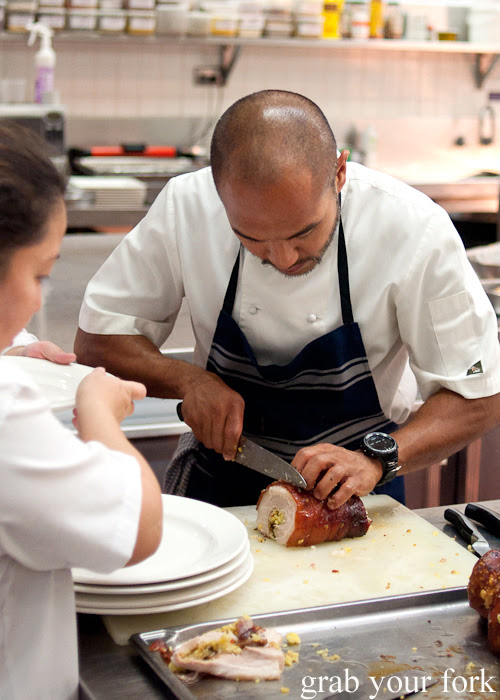 Chef JP Anglo carving the rolled pork belly at the Filipino Barbie