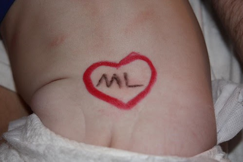 A tattoo. Right above her cute little tush.