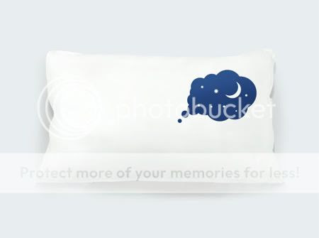 white pillow with dark dream design