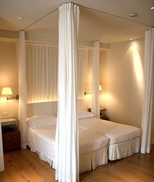 You can recreate the look of a canopy bed with curtains that are ...