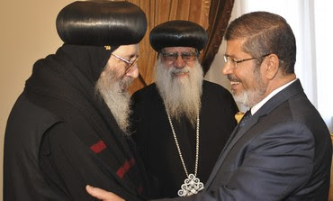 Mohamed Mursi greets Coptic Bishop Beshoy