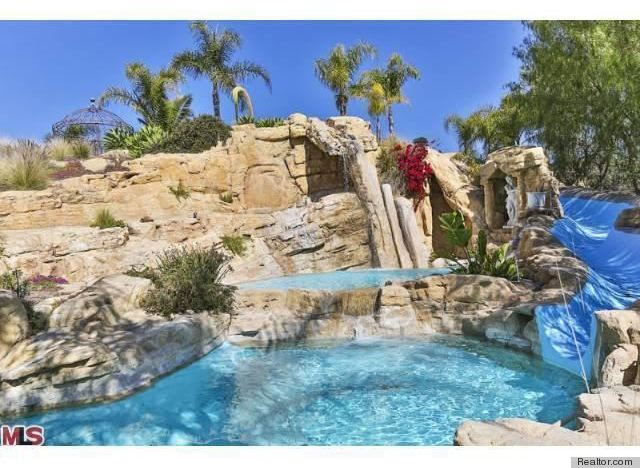 6 Epic Water Slides That Make A Lavish Swimming Pool Even Better (