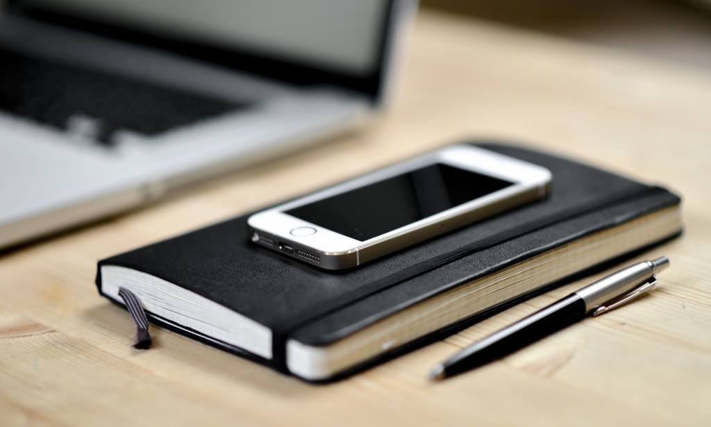 Workdesk with phone and notebook