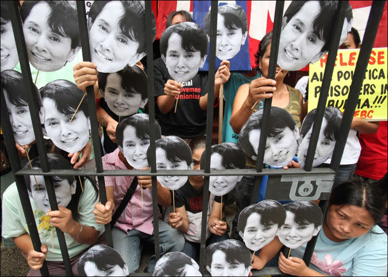 Protesters in Manila display portraits of Burmese pro-democracy leader Aung San Suu Kyi
