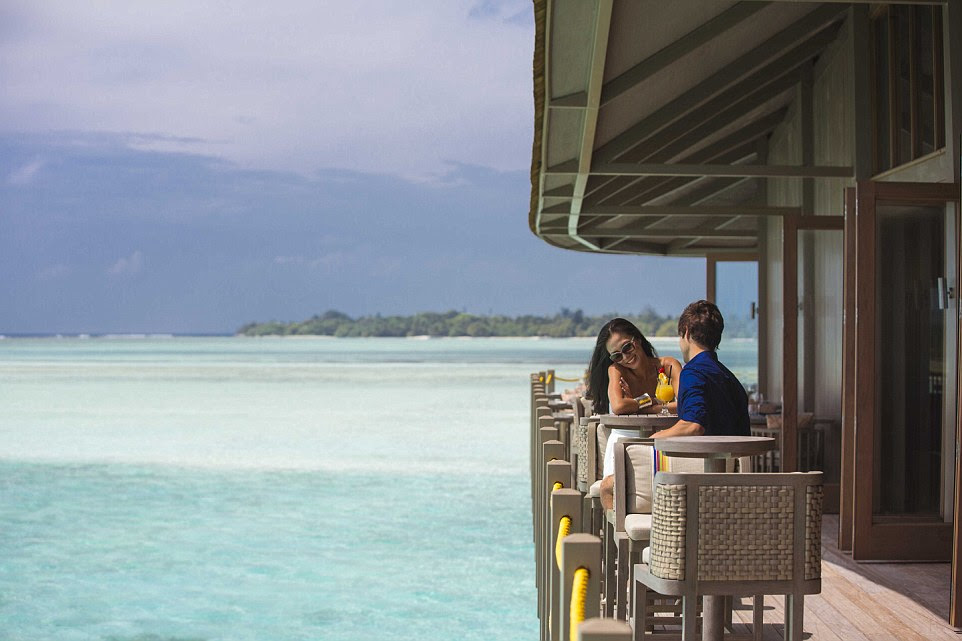Long lunch: The restaurant sits on stilts over the water so you can admire the sea life in the sparkling turquoise water just below